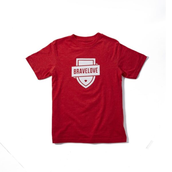 A Kids/Youth T-Shirt in red featuring "BRAVELOVE" written across a shield emblem in white on the front.